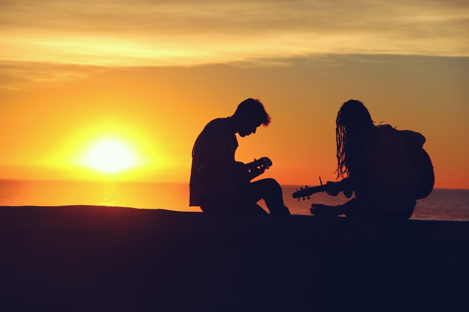 Playing guitar on a beach